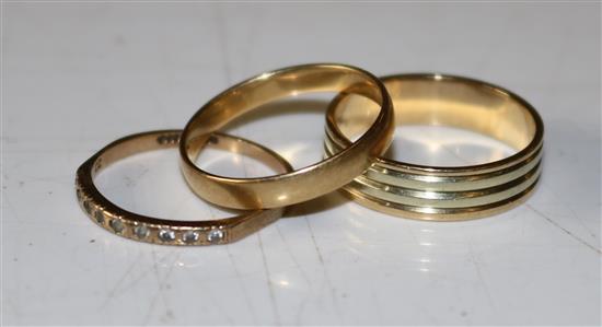 An 18ct gold wedding ring and 2 others